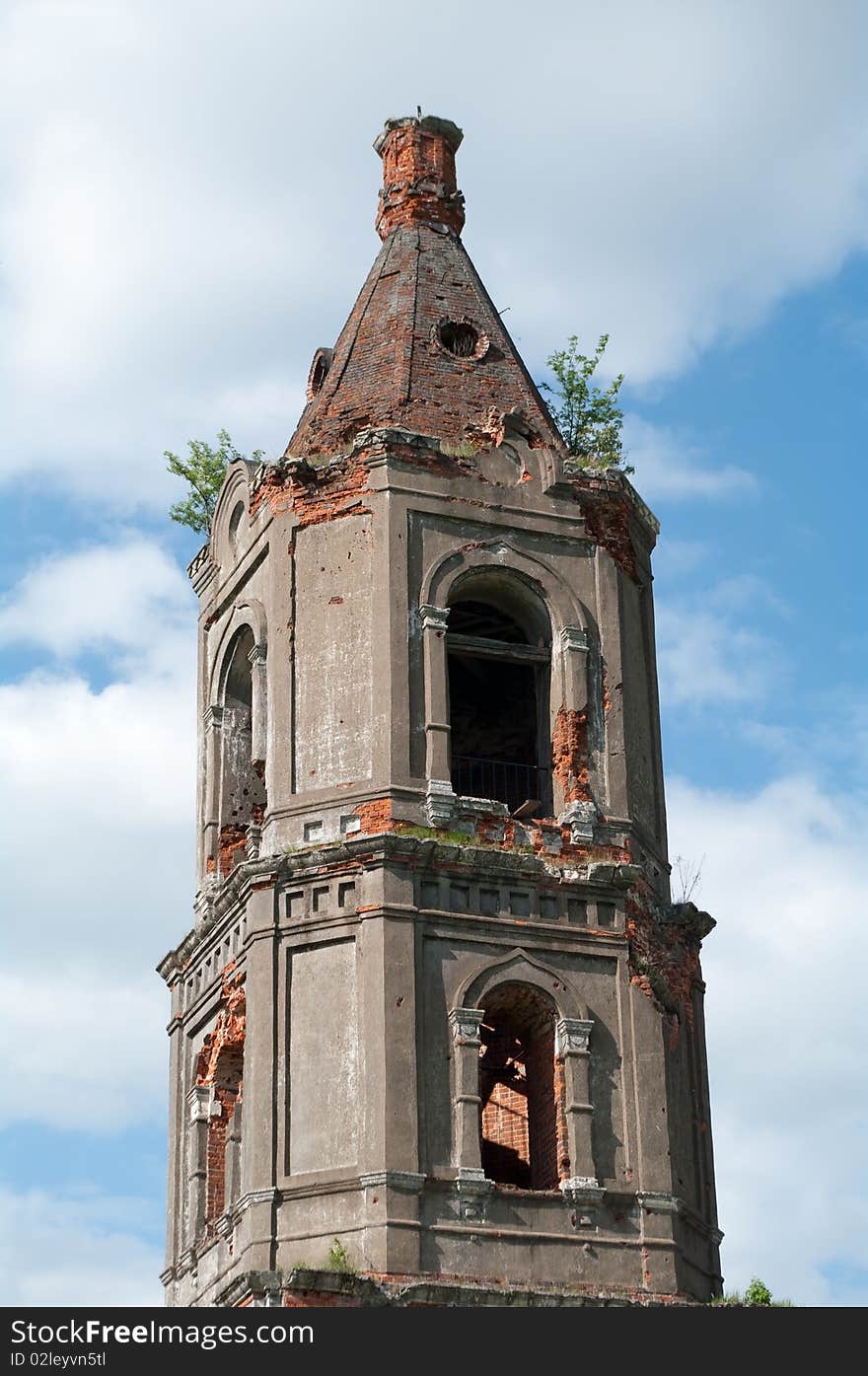 Ruins of old brick church against the blue sky with clouds. Ruins of old brick church against the blue sky with clouds