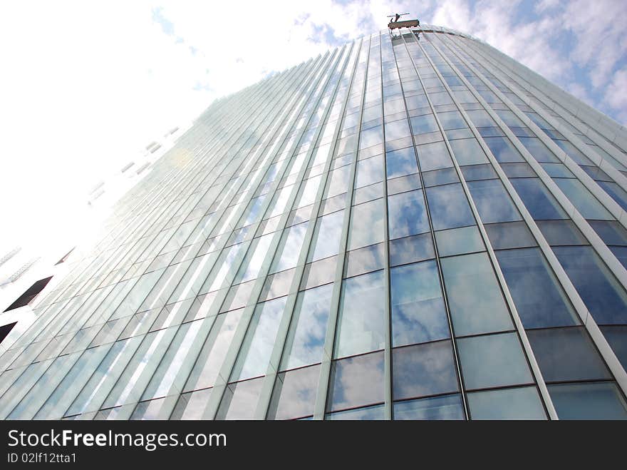 Architectural details of a modern glass wall of an office building. Architectural details of a modern glass wall of an office building