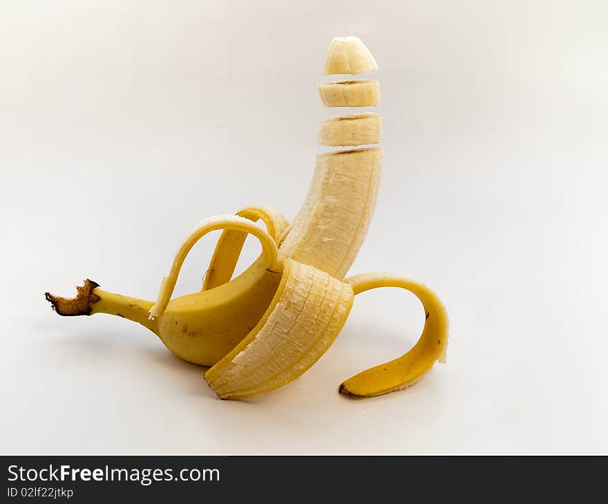 Levitating banana on white background