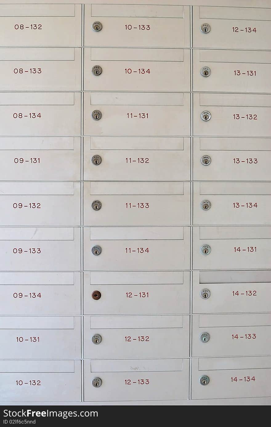 Row of metallic letter boxes with numbers and locks. For concepts such as safety and security, business communication and concepts. Row of metallic letter boxes with numbers and locks. For concepts such as safety and security, business communication and concepts.