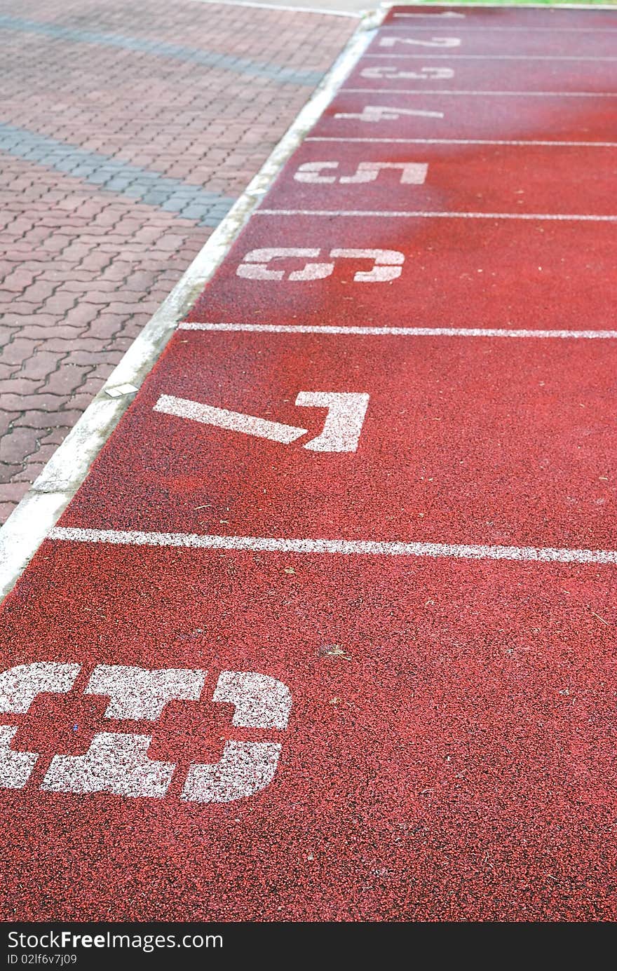 Numbered running track at the stadium. For sports and exercise, dieting and slimming, and healthy lifestyle concepts.