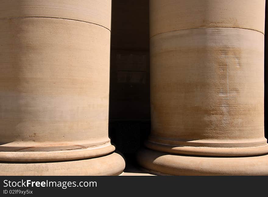 Two huge pillars of an historic court house. Two huge pillars of an historic court house