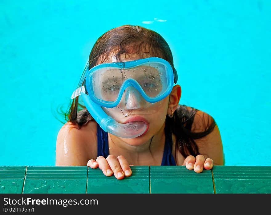 Beautiful Girl In A Pool With A Swimming Mask