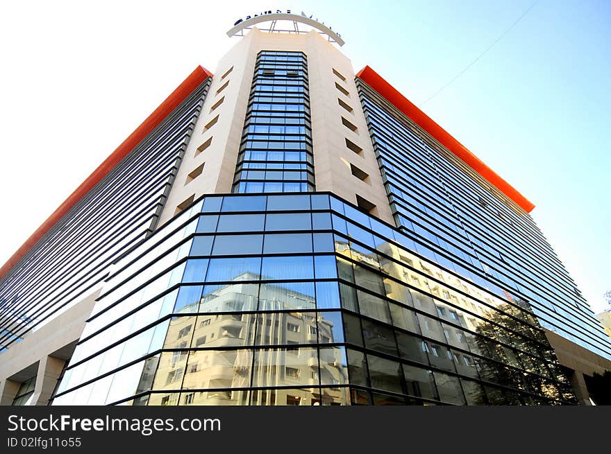 A modern building with blue mirror walls