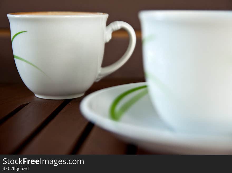 Coffee and tea in white ceramic cup. Coffee and tea in white ceramic cup