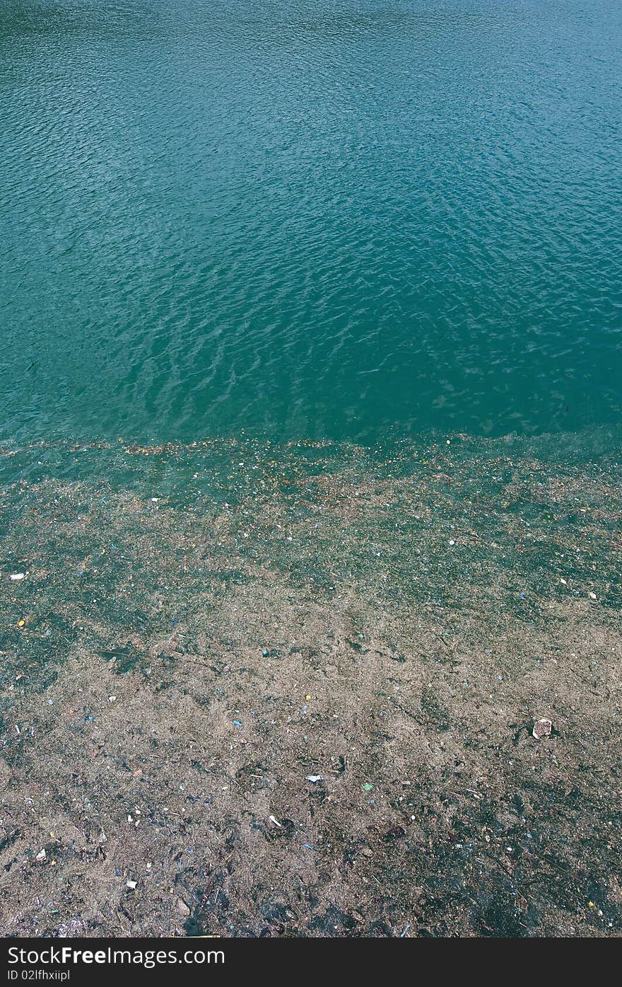 Trash floating on contaminated waters