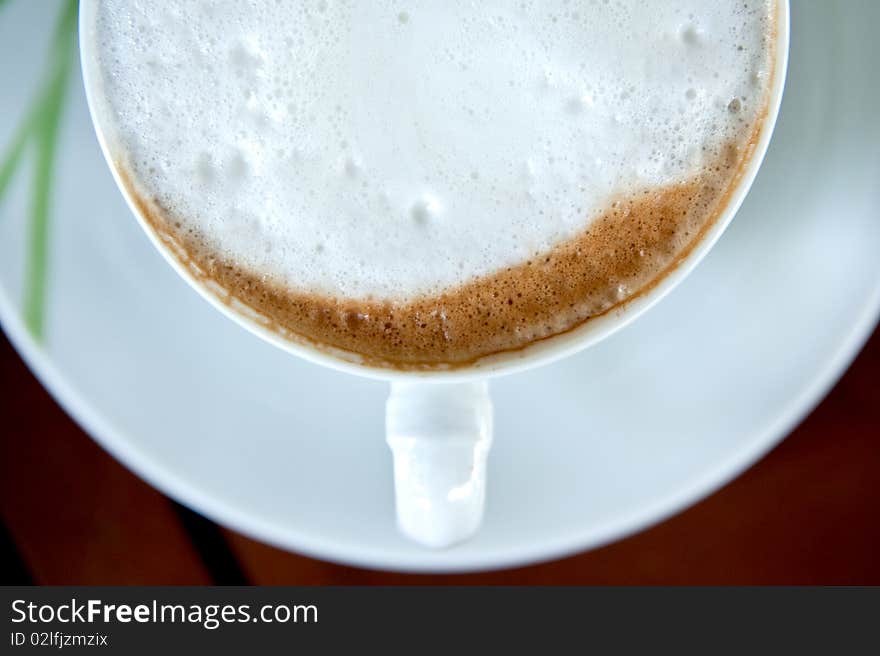 Capuccino  coffee in white ceramic cup. Capuccino  coffee in white ceramic cup