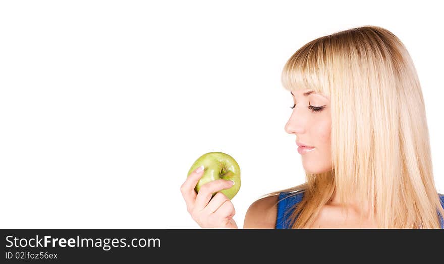 Portrait of a beautiful blonde who looks at the apple. Portrait of a beautiful blonde who looks at the apple