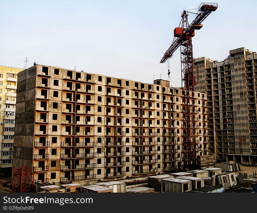 Building with elevating crane over sky. Building with elevating crane over sky