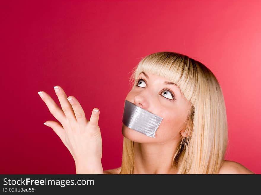 Girl with a scotch mouth shows his hand up. Girl with a scotch mouth shows his hand up