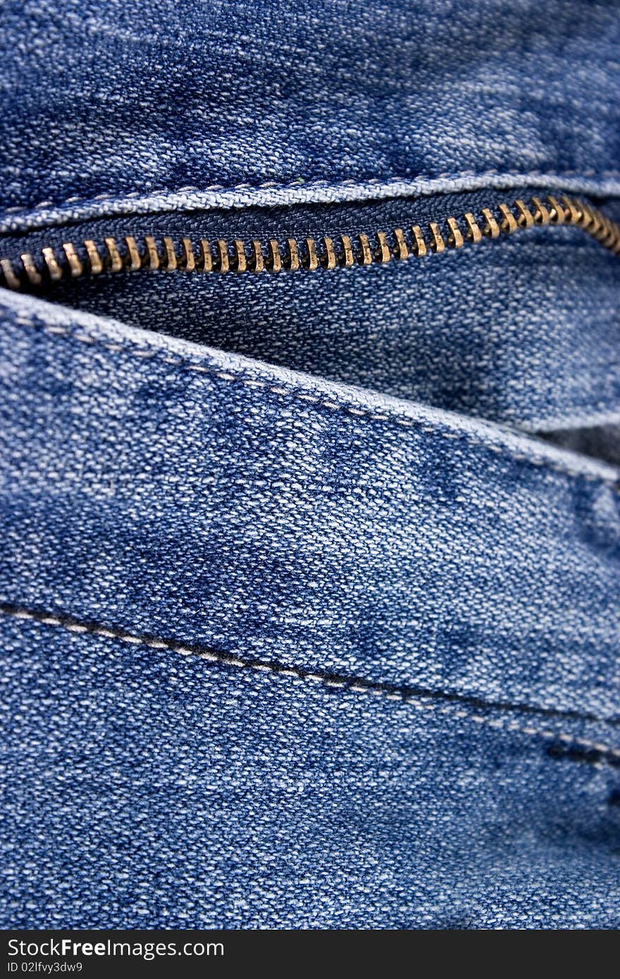 Closeup of blue jeans with zipper.