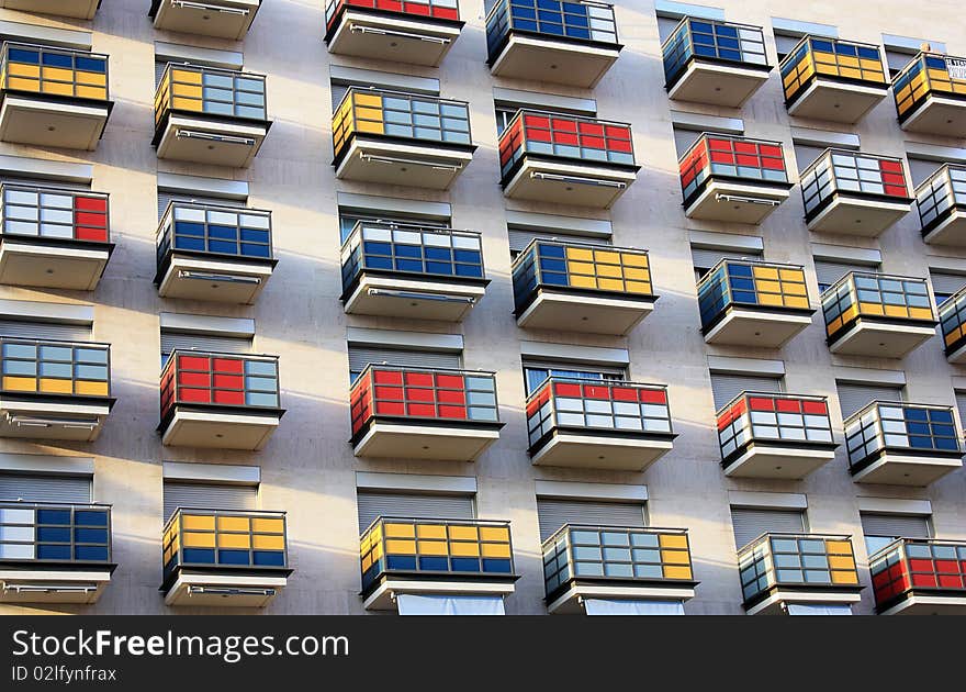 Multi-coloured balconies of a modern building in a city similar to a Cube Rubic. Multi-coloured balconies of a modern building in a city similar to a Cube Rubic