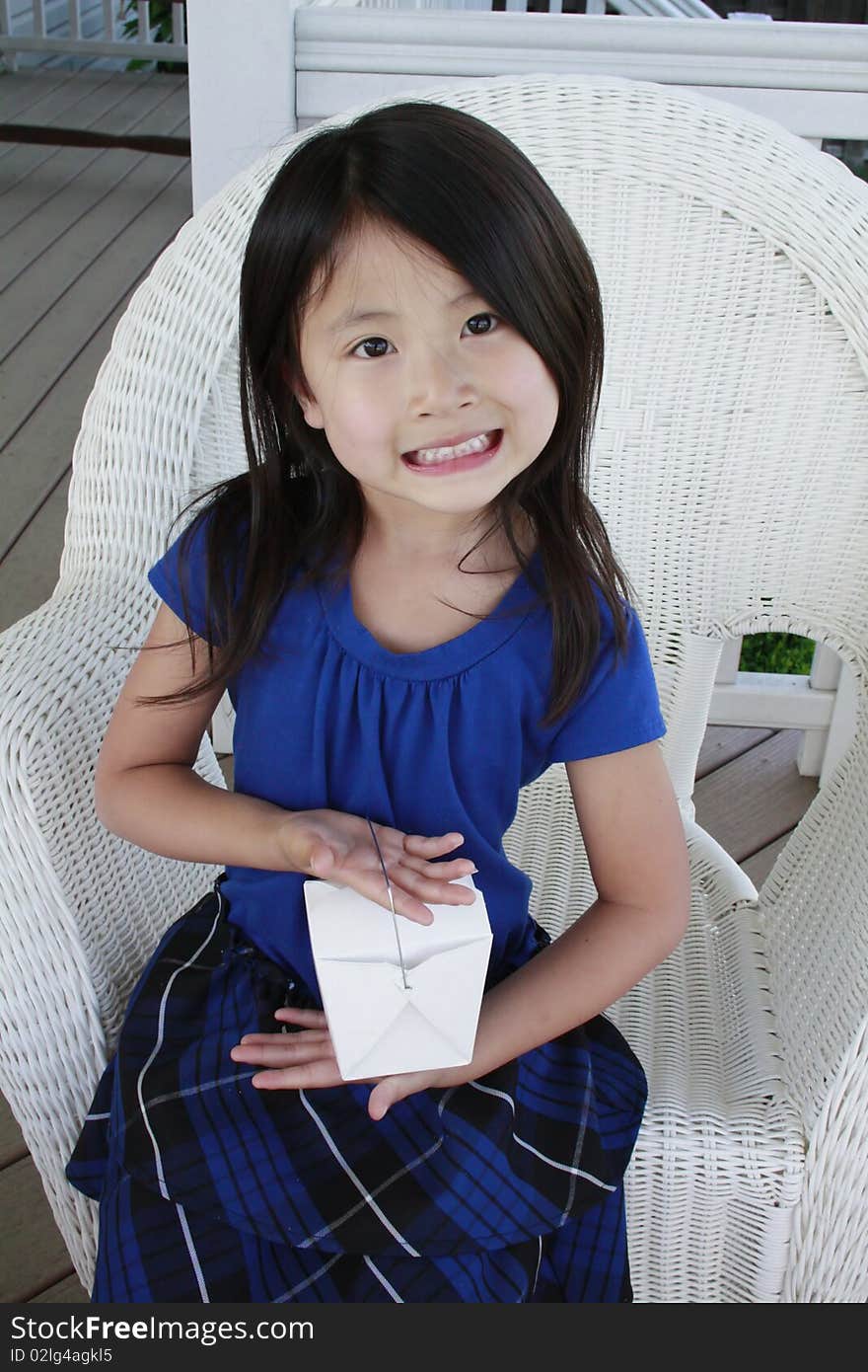 Little asia girl holding take out container. Little asia girl holding take out container