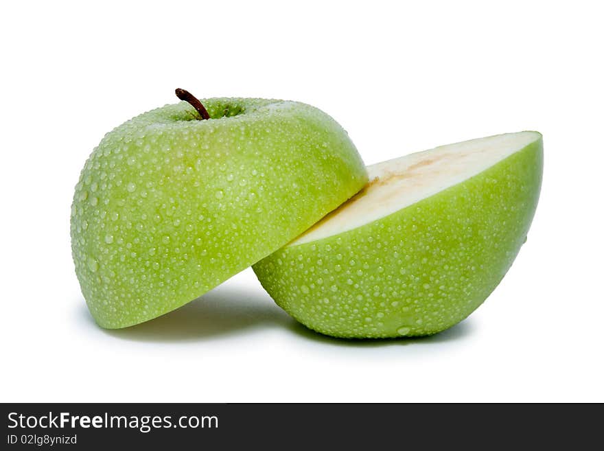 Big green slited apple with water dropes