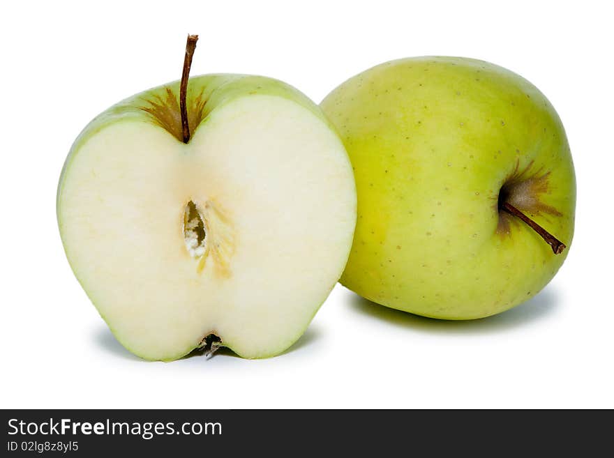 Big green slited apple and whole apple