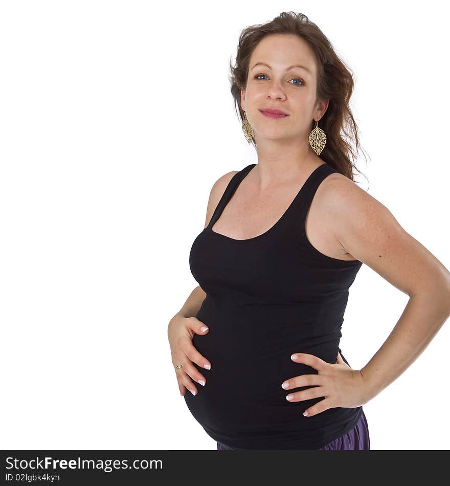 Young pregnant woman in a studio setting isolated over white. Young pregnant woman in a studio setting isolated over white.