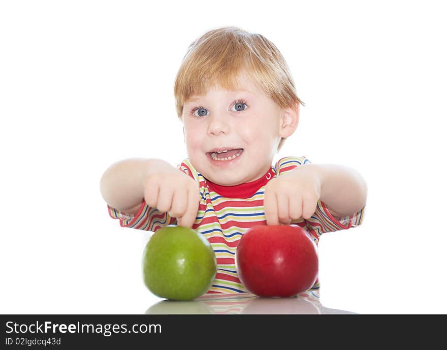 The little boy with apples in hands on a background. The little boy with apples in hands on a background