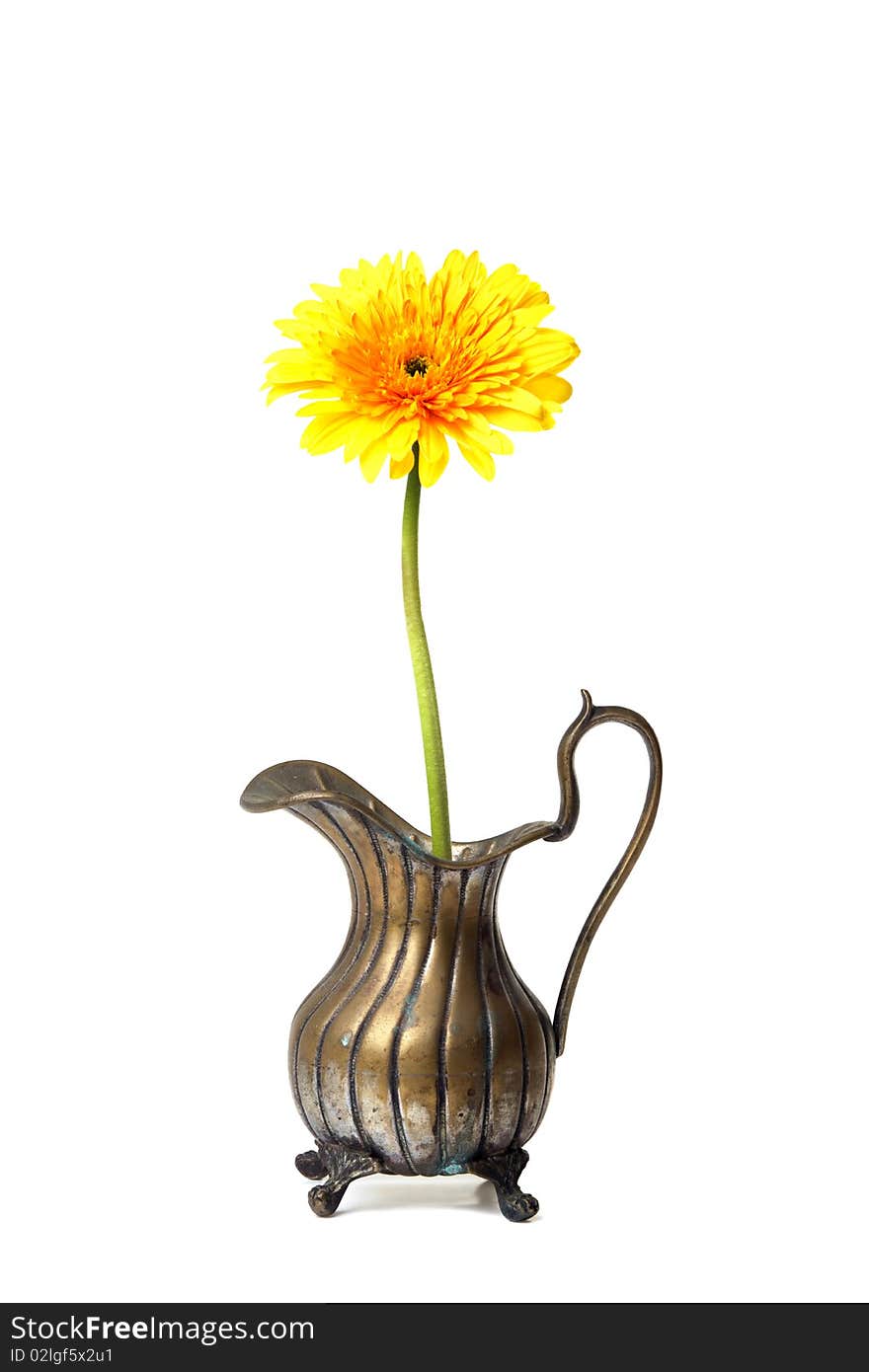 Ancient brass ewer with flower