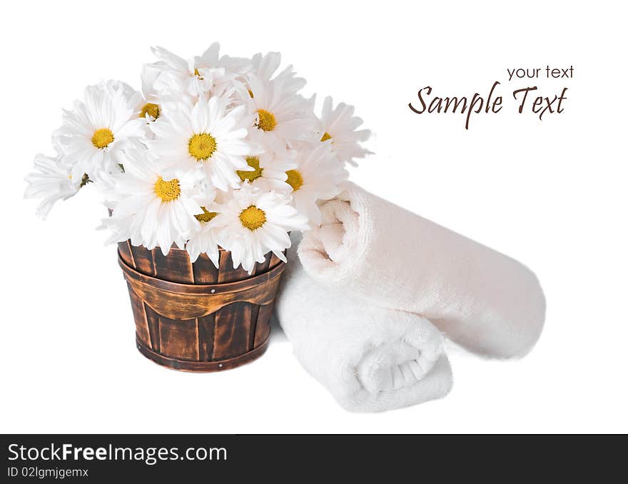 Flowers and towels isolated on white