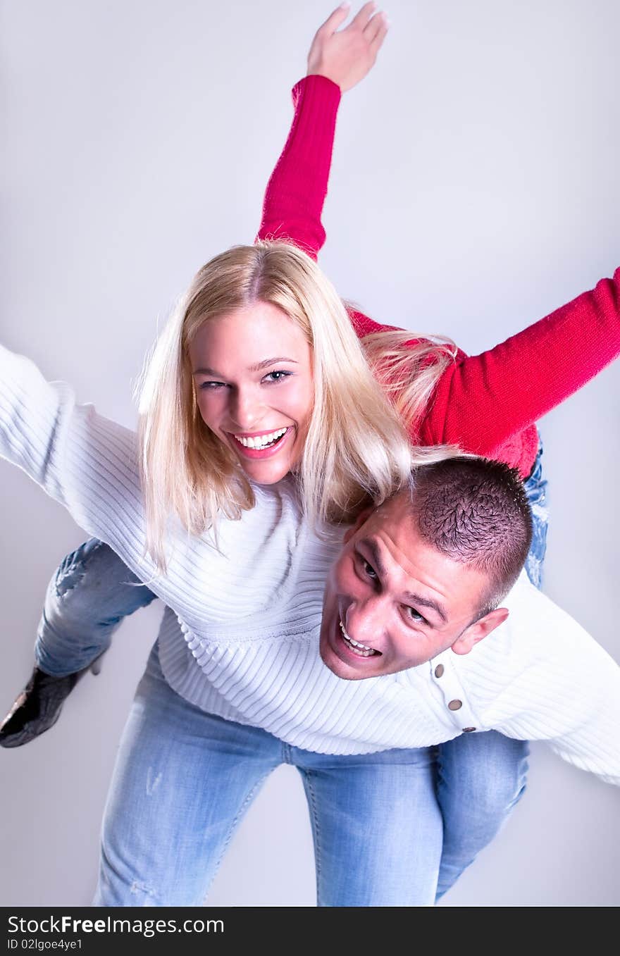 Happy Young loving couple hugging and smile , studio shot