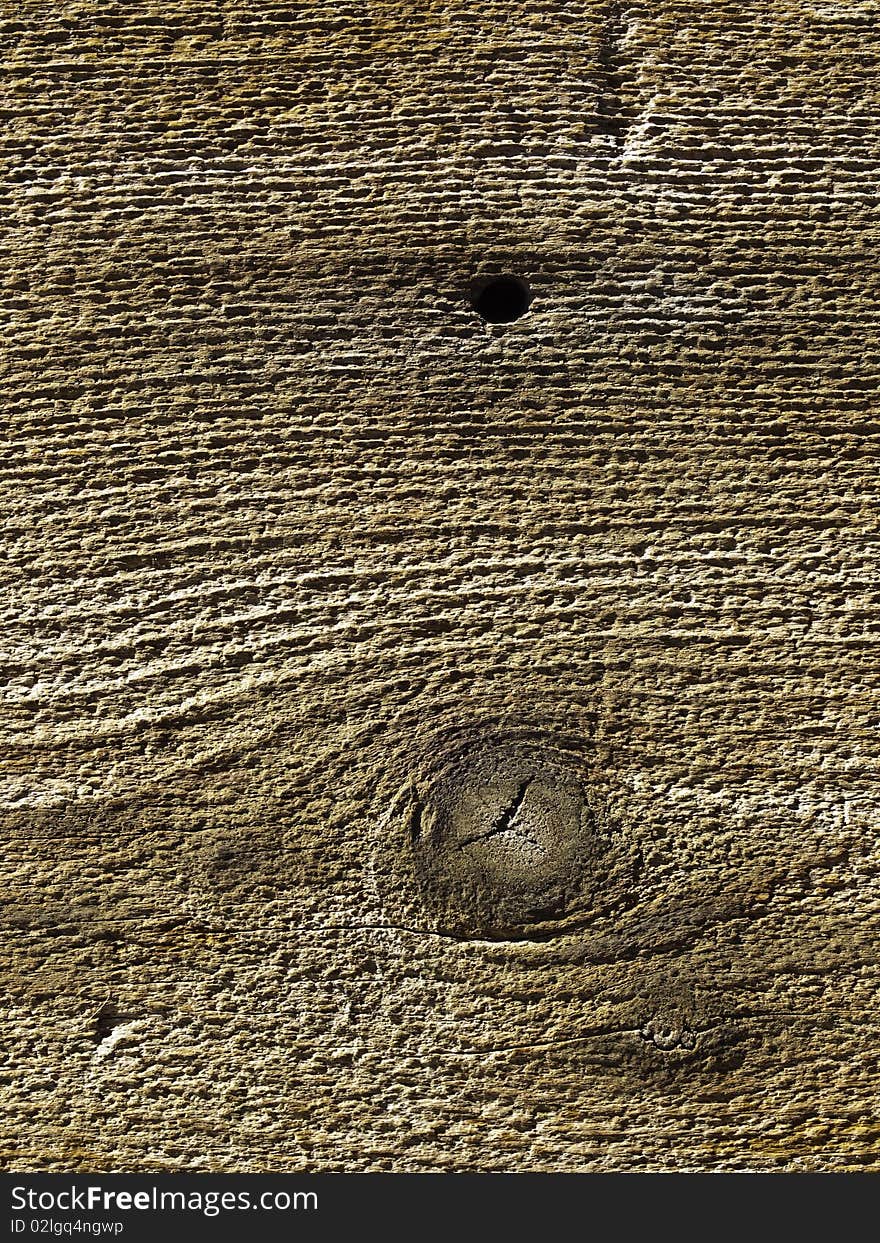 Old weathered grainy wood surface with knot and hole. Old weathered grainy wood surface with knot and hole