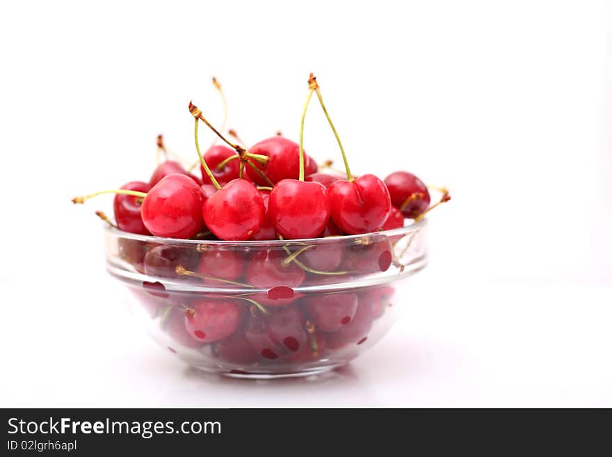 Fresh Cherries On A Glass Plate, On A White Background