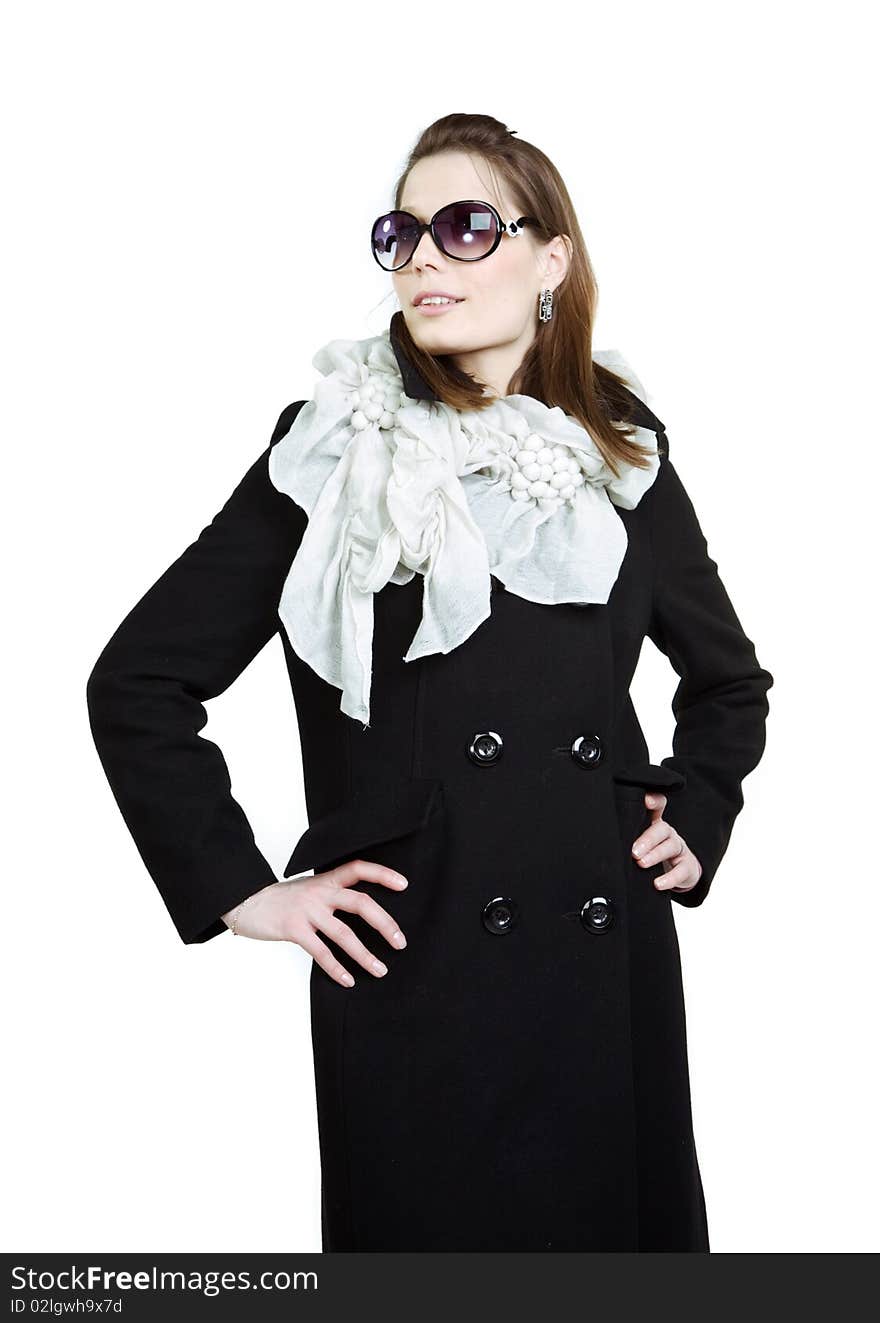 Fashionable girl in an autumn coat over white