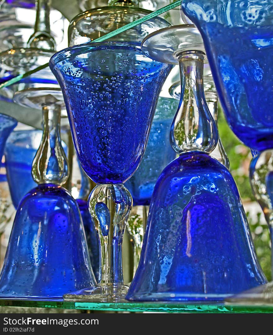 Blue bubble goblets on a store shelf. Blue bubble goblets on a store shelf