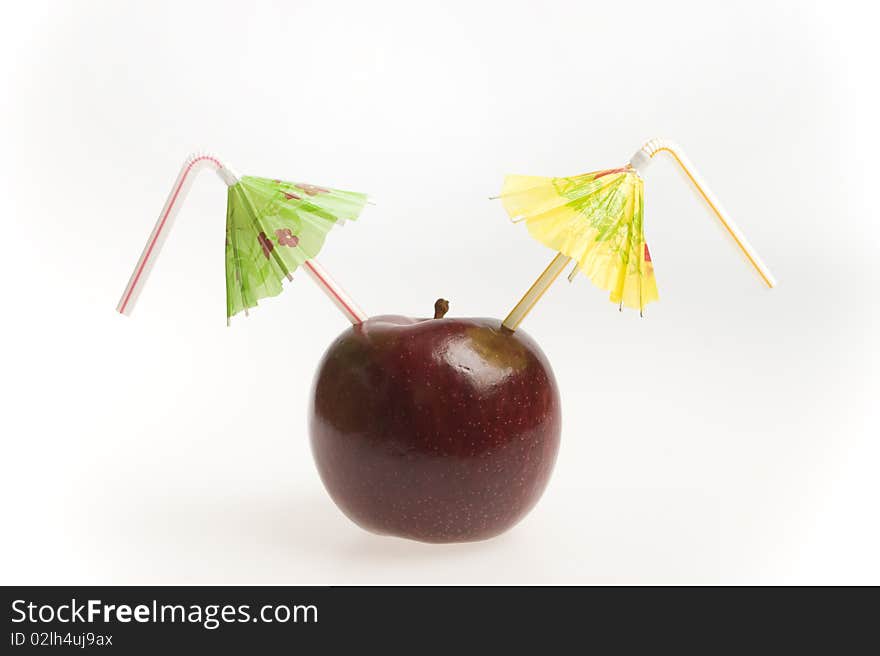 Red apple with two straws