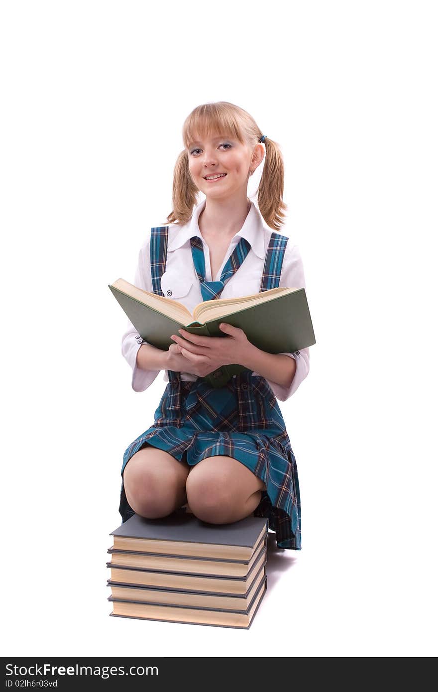 Senior high school student in uniform with documents is sitting on the stack of book. Young and beautiful schoolgirl is wearing a traditional uniform is reading textbook. Senior high school student in uniform with documents is sitting on the stack of book. Young and beautiful schoolgirl is wearing a traditional uniform is reading textbook.