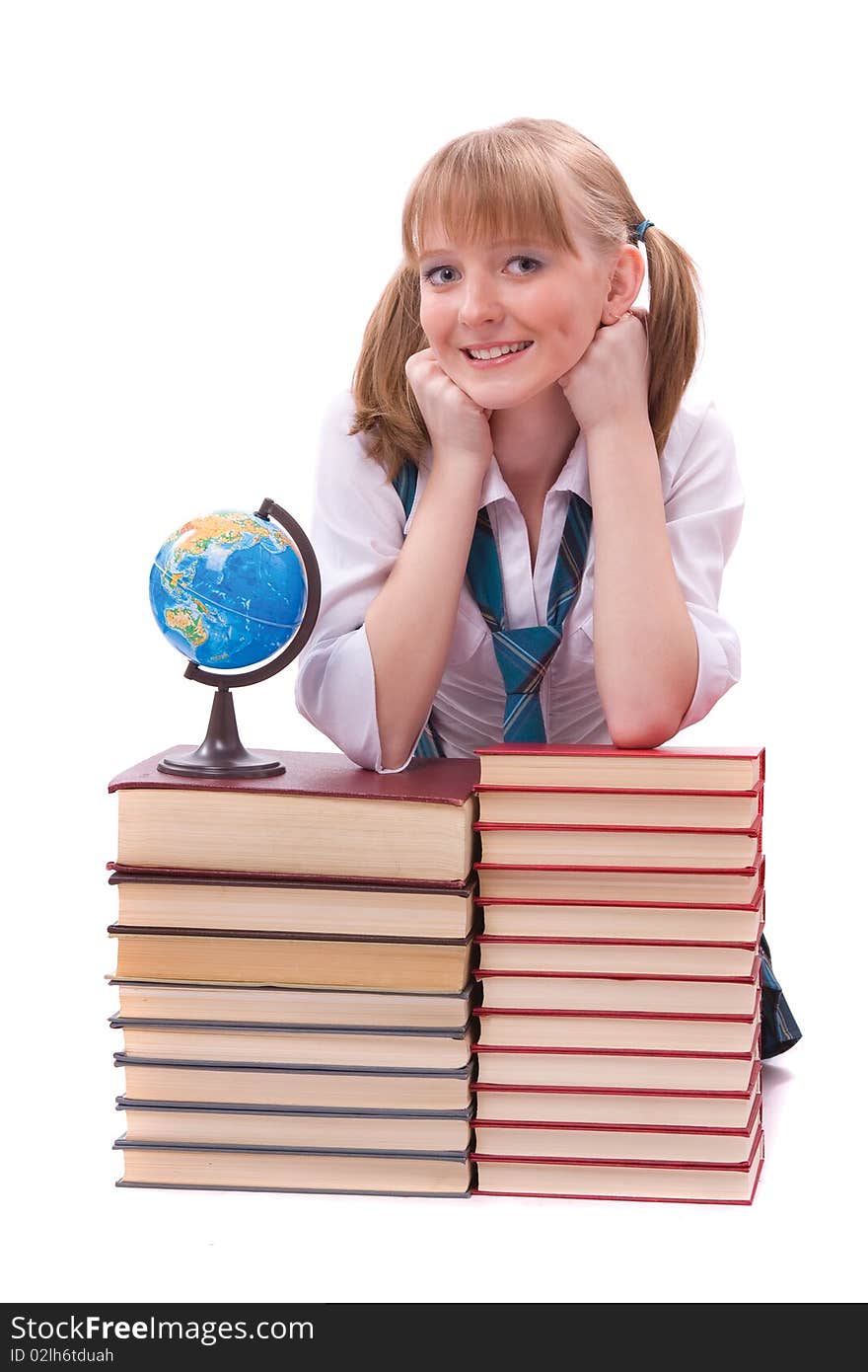 Senior high school student in uniform with the stack of book and globe. A young and beautiful schoolgirl is wearing a traditional uniform with textbooks. Senior high school student in uniform with the stack of book and globe. A young and beautiful schoolgirl is wearing a traditional uniform with textbooks.