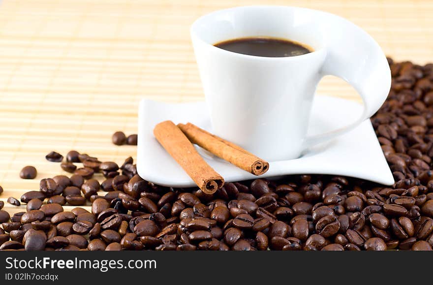 Cup of coffee on top of coffee beans. Cup of coffee on top of coffee beans