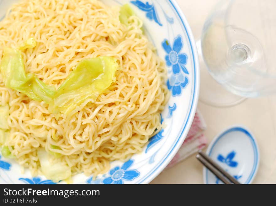 Asian vegetarian yellow noodles with healthy vegetables. Suitable for concepts such as diet and slimming, healthy lifestyle, and food and beverage. Asian vegetarian yellow noodles with healthy vegetables. Suitable for concepts such as diet and slimming, healthy lifestyle, and food and beverage.