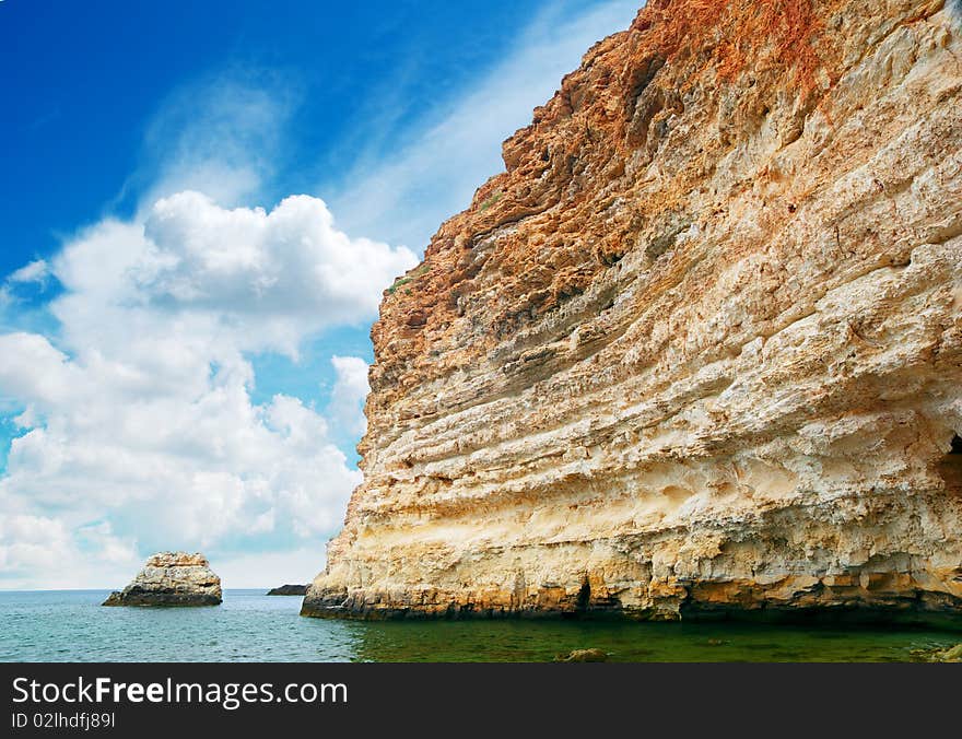 Rock in sea and deep blue sky. Nature composition.