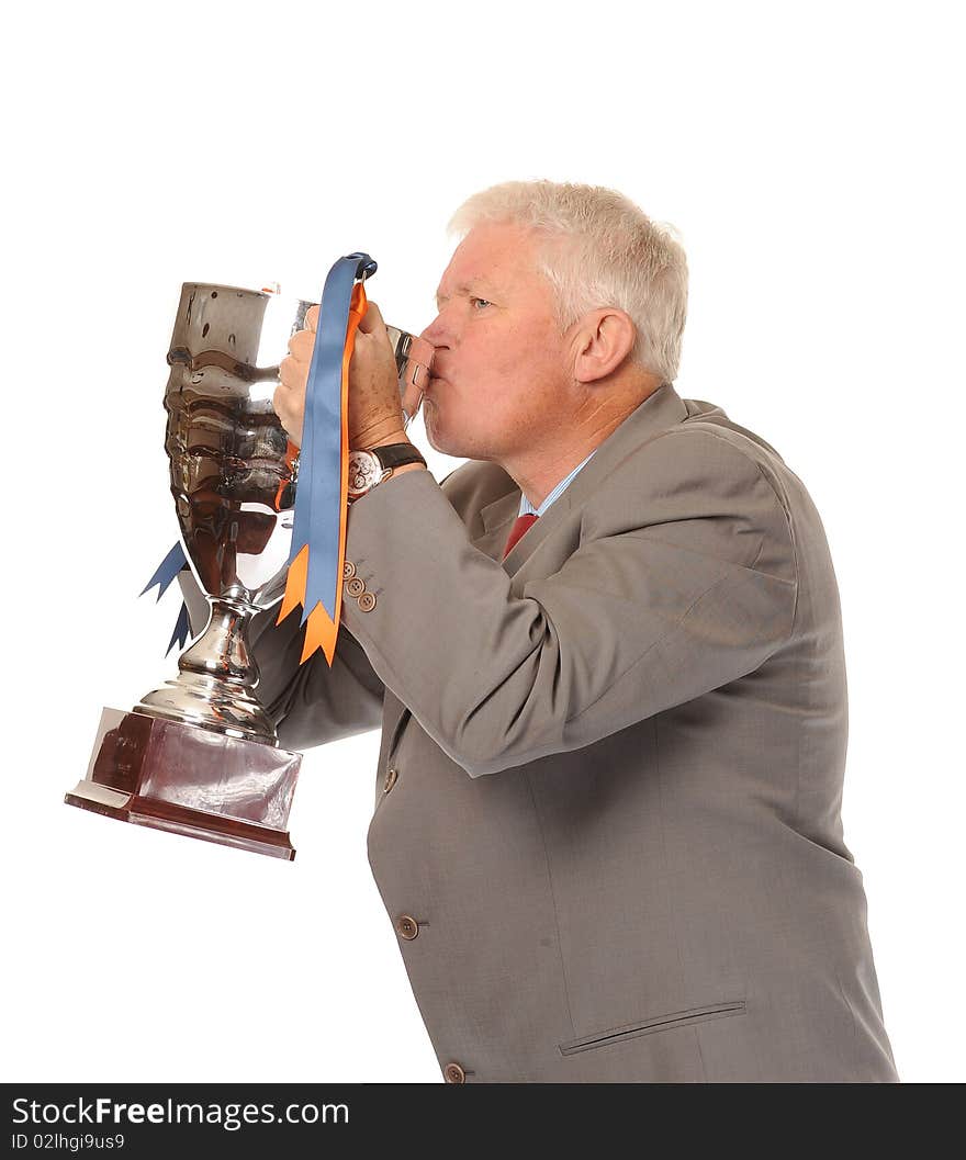 Successful mature business man on white background, holding trophy. Successful mature business man on white background, holding trophy