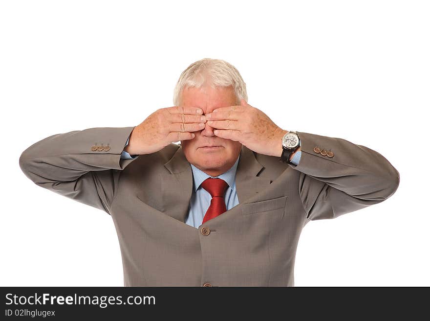 Successful mature businessman covering eyes