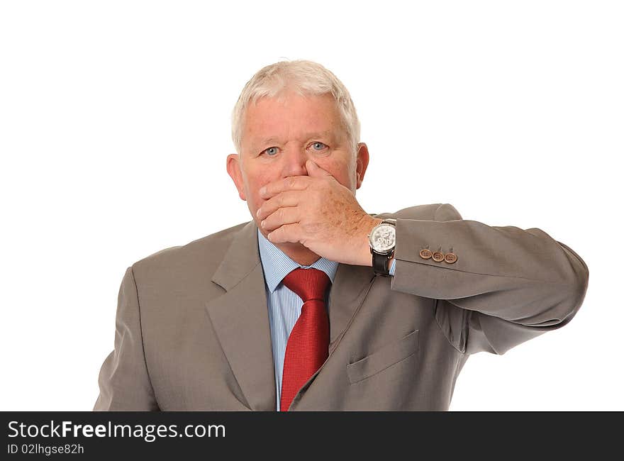 Successful mature business man on white background, covering mouth. Successful mature business man on white background, covering mouth