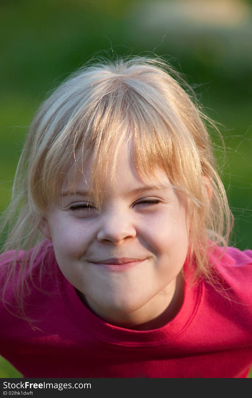 Portrait of little smiling girl outdoor