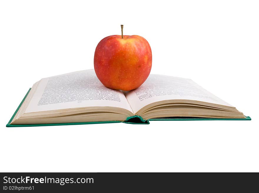 Apple on an open book on white background. Apple on an open book on white background