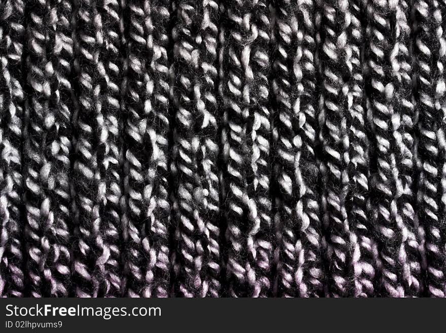 Black sweater texture background closeup