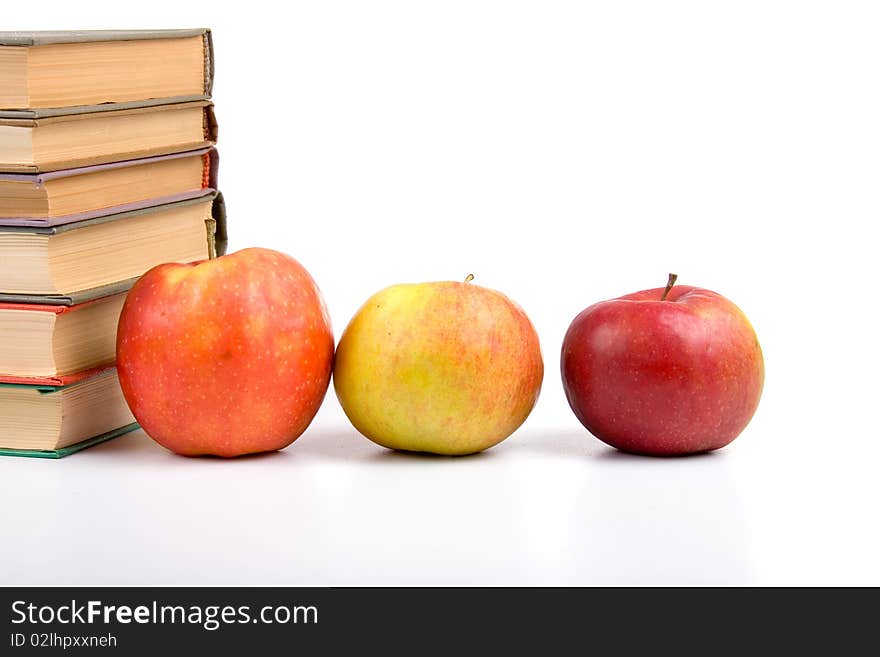 Apples and books isolated on a white background