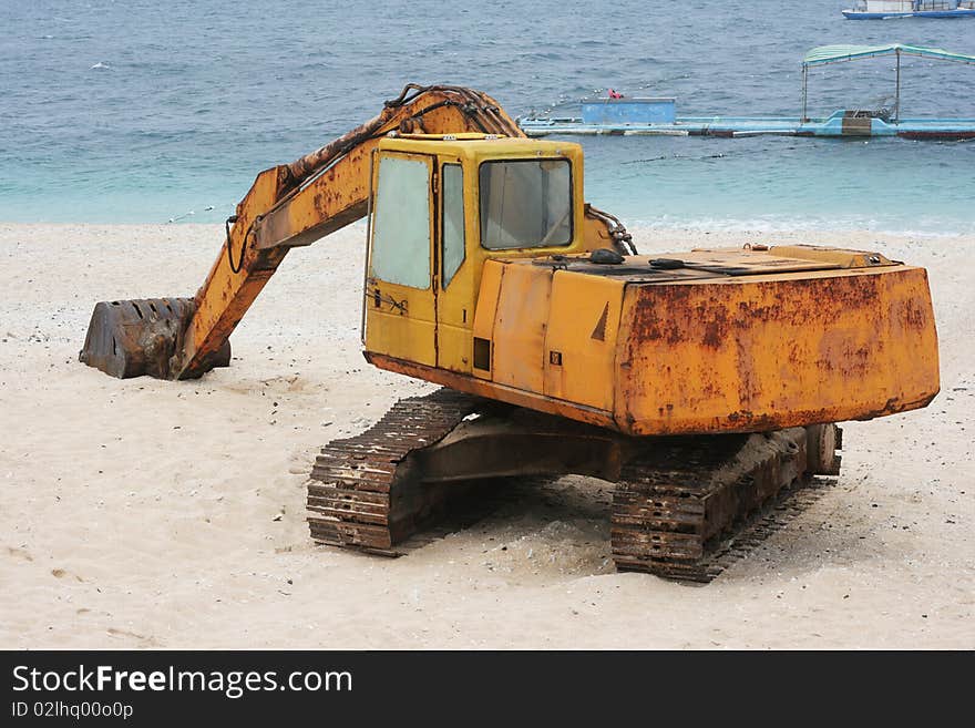 Rusted Digger On A Beautiful White Beach