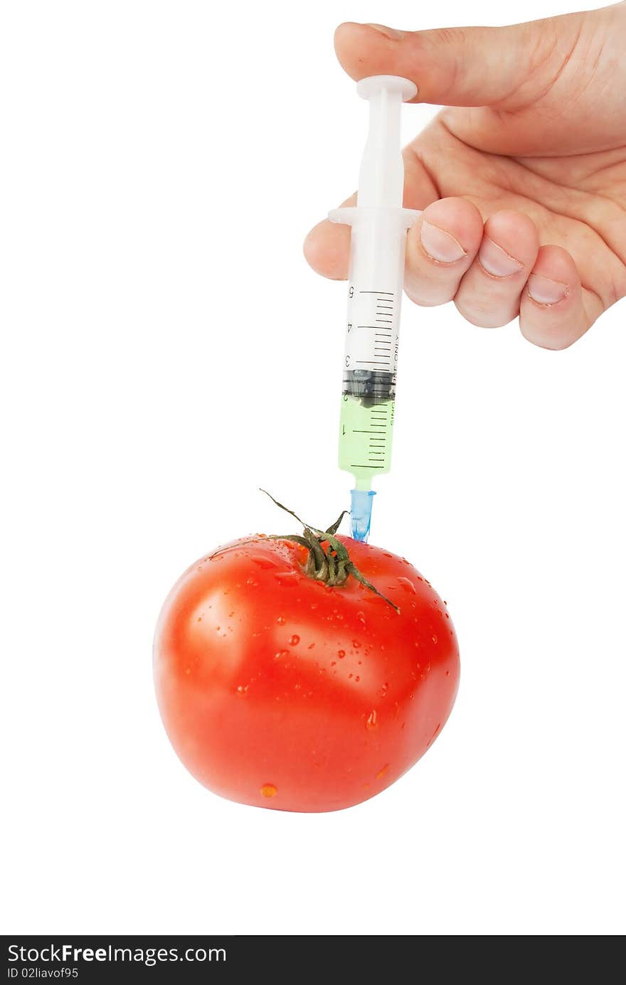 Human Hand With Syringe And Red Tomato