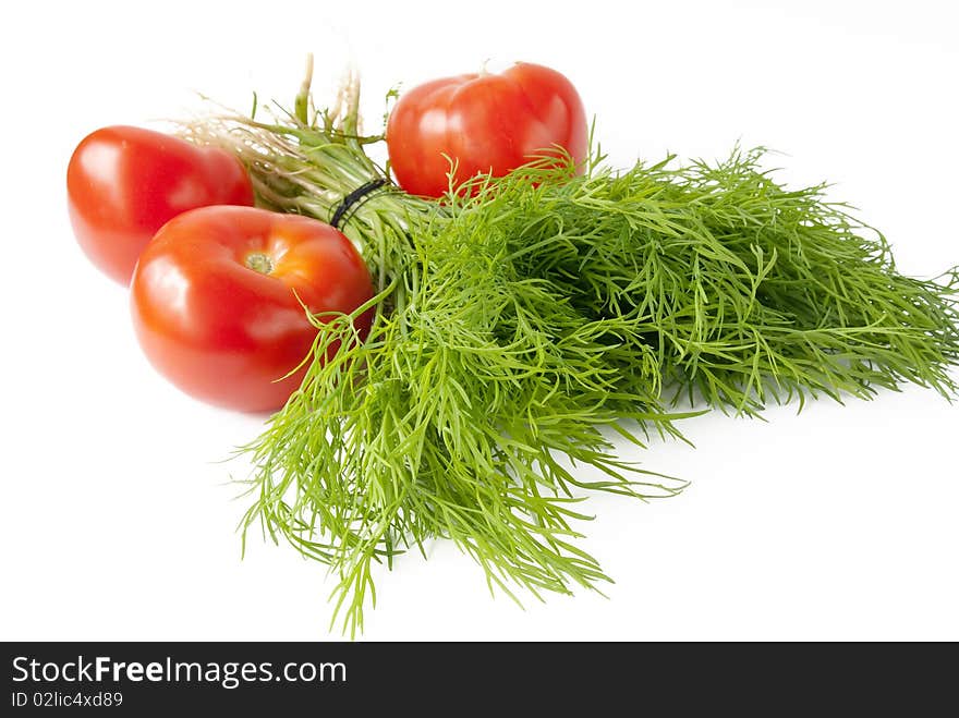 Dill with red tomato over white background