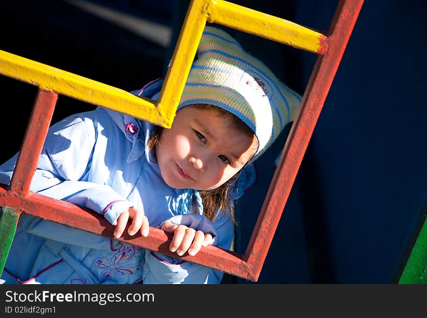 Girl looking through coloured zigzag