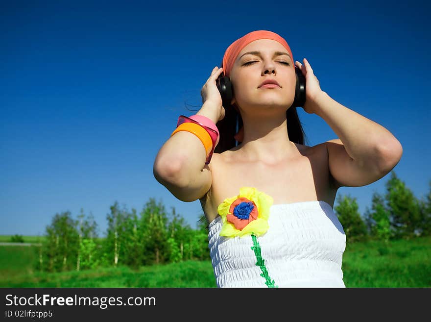 Girl in kerchief with headphones. Girl in kerchief with headphones