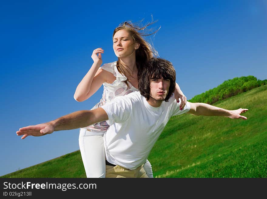 Long-haired girl and boy in white t-shirt