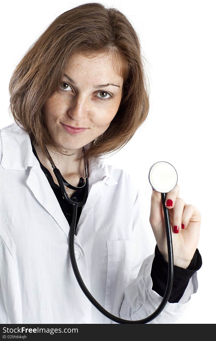 Young nurse with stethoscope in hand on white background