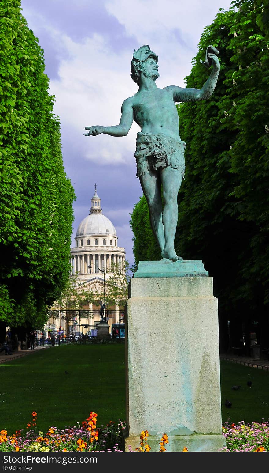 A greek statue beckons in the park with the Pantheon in the background. A greek statue beckons in the park with the Pantheon in the background.