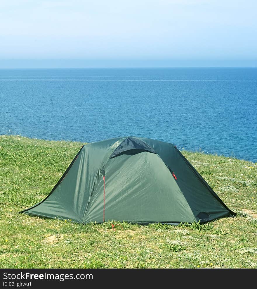 Tourist tent on seashore in the sunshine day